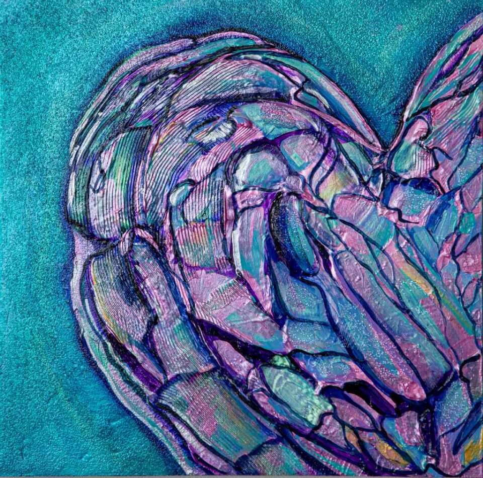 An off-centre blue and pink heart on ablue background.