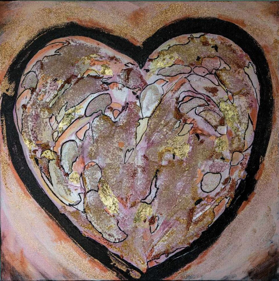 A large pink and gold heart outlined boldly in black on a pink and gold background.