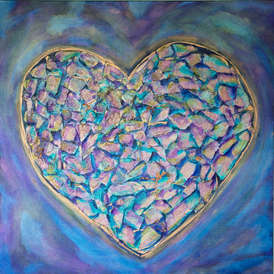 A large blue heart outlined in gold is filled with many irregular shpes in blue, pink, and gold. The heart fills the frame and has a purple background